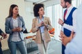 Business team having a meeting standing in the office. Royalty Free Stock Photo