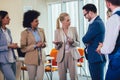 Business team having a meeting standing in the office. Selective focus Royalty Free Stock Photo