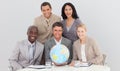 Business team holding a terrestrial globe