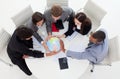 Business team holding a terrestrial globe