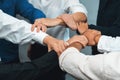 Business team joining hand in circular together. Prudent