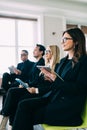 Business team listen seminar presenter at corporate conference speech workshop discussion in hall during company training event