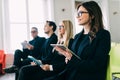 Business team listen seminar presenter at corporate conference speech workshop discussion in hall during company training event