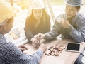 Business team making a structure with wooden cubes. Building a business concept.,Team of Asian engineers discussing blueprint at Royalty Free Stock Photo