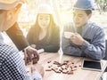 Business team making a structure with wooden cubes. Building a business concept.,Team of Asian engineers discussing blueprint at Royalty Free Stock Photo