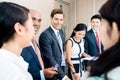 Business team meeting of Asian and Caucasian executives Royalty Free Stock Photo