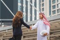 Business team meeting outdoors, Arab Business handshake with partnership, Arabic business people shaking hands