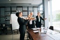 Business team of multiethnic coworkers people holding Bengal lights, clinking glasses of champagne. Royalty Free Stock Photo