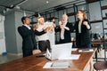 Business team of multiethnic coworkers people holding Bengal lights, clinking glasses of champagne. Royalty Free Stock Photo