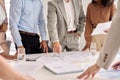 Business team people work with papers standing at table office meeting, close up. Royalty Free Stock Photo