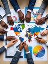 Business Team Planning Around World Map and Charts â Flat Lay for Global Strategy, Data Analysis, and Collaboration Royalty Free Stock Photo