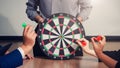 Business team pointing to a darts aiming at the target center business,Targeting the business concept