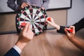 Business team pointing to a darts aiming at the target center business,Targeting the business concept