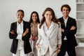 Business team portrait. Diverse young business people posing in office interior and smiling at camera Royalty Free Stock Photo