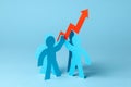 Business team and red up arrow. Sales growth and growth graph up. Royalty Free Stock Photo