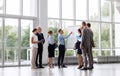 Business team with scheme on flip chart at office Royalty Free Stock Photo