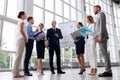 Business team with scheme on flip chart at office