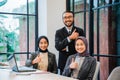 business team showing thumb up while sitting at the office Royalty Free Stock Photo