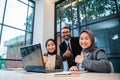 business team showing thumb up while sitting at the office Royalty Free Stock Photo