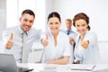 Business team showing thumbs up in office Royalty Free Stock Photo