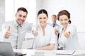 Business team showing thumbs up in office Royalty Free Stock Photo