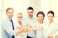 Business team showing thumbs up in office Royalty Free Stock Photo