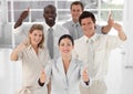 Business Team Smiling Holding up Thumbs Royalty Free Stock Photo