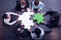 Business team solving puzzle Royalty Free Stock Photo