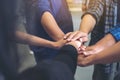 Business team standing and joining their hands together in office Royalty Free Stock Photo