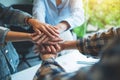 Business team standing and joining their hands together in office Royalty Free Stock Photo