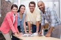 Business team standing and smiling at camera during meeting Royalty Free Stock Photo