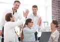 Business team starts a business project and giving each other a high five