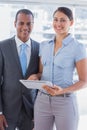 Business team with tablet pc smiling Royalty Free Stock Photo