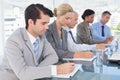 Business team taking notes during conference Royalty Free Stock Photo