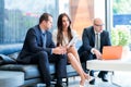 A business team of three sitting in office and planning work. Us