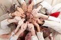 Business team with thumbs up lying in a circle Royalty Free Stock Photo