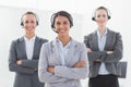 Business team wearing headsets and standing arms crossed Royalty Free Stock Photo