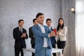 Business team winning trophy in the office, Asian businessman showing trophy and reward of success Royalty Free Stock Photo