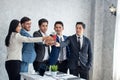Business team winning trophy in the office, Asian businessman showing trophy and reward of success Royalty Free Stock Photo