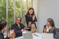 Business team winning trophy in the office . Businessman with teamwork in award and successful showing trophy and rewarded for in Royalty Free Stock Photo