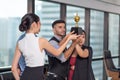 Business team winning trophy in the office, Business People with teamwork in award and successful showing trophy and rewarded Royalty Free Stock Photo