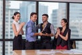 Business team winning trophy in the office, Business People with teamwork in award and successful showing trophy and rewarded Royalty Free Stock Photo