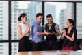 Business team winning trophy in the office, Business People with teamwork in award and successful showing trophy and rewarded Royalty Free Stock Photo