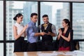 Business team winning trophy in the office, Business People with teamwork in award and successful showing trophy and rewarded Royalty Free Stock Photo