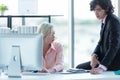 Business team women and man using computer to work with financial data. Partners discussing graph of report growth and working her Royalty Free Stock Photo