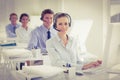 Business team working on computers and wearing headsets Royalty Free Stock Photo