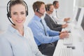 Business team working on computers and wearing headsets Royalty Free Stock Photo