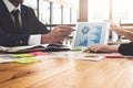 Business team working on tablet and documents at workplace wooden desk in office. Business Team Corporate Organization Working Co