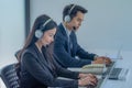 Business team working together at a call center wearing headsets Royalty Free Stock Photo