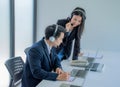 Business team working together at a call center wearing headsets Royalty Free Stock Photo